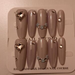 Gorgeous nails color is purple.Hand Size Small